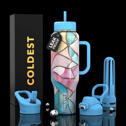 Leak-proof stained glass water bottle with blue lid, handle, and straw, next to COLDEST box and accessories