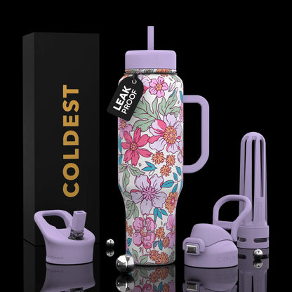 Floral print leak-proof water bottle with purple lid, handle, and accessories, next to branded box