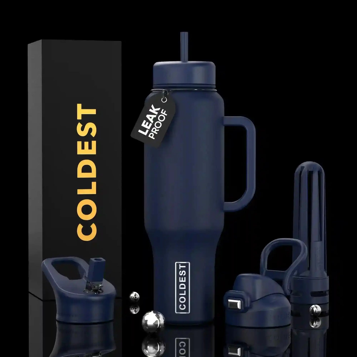 Coldest leak-proof insulated tumbler with handle, straw, and accessories on black background
