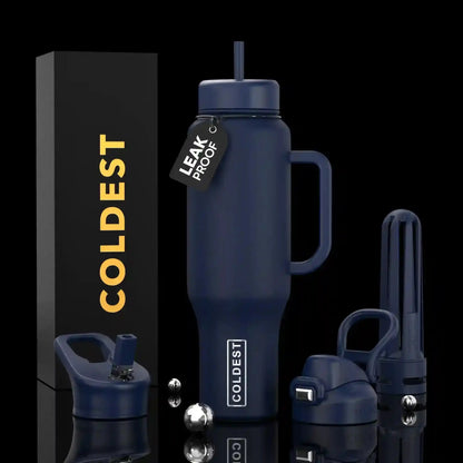 Coldest leak-proof insulated tumbler with handle, straw, and accessories on black background