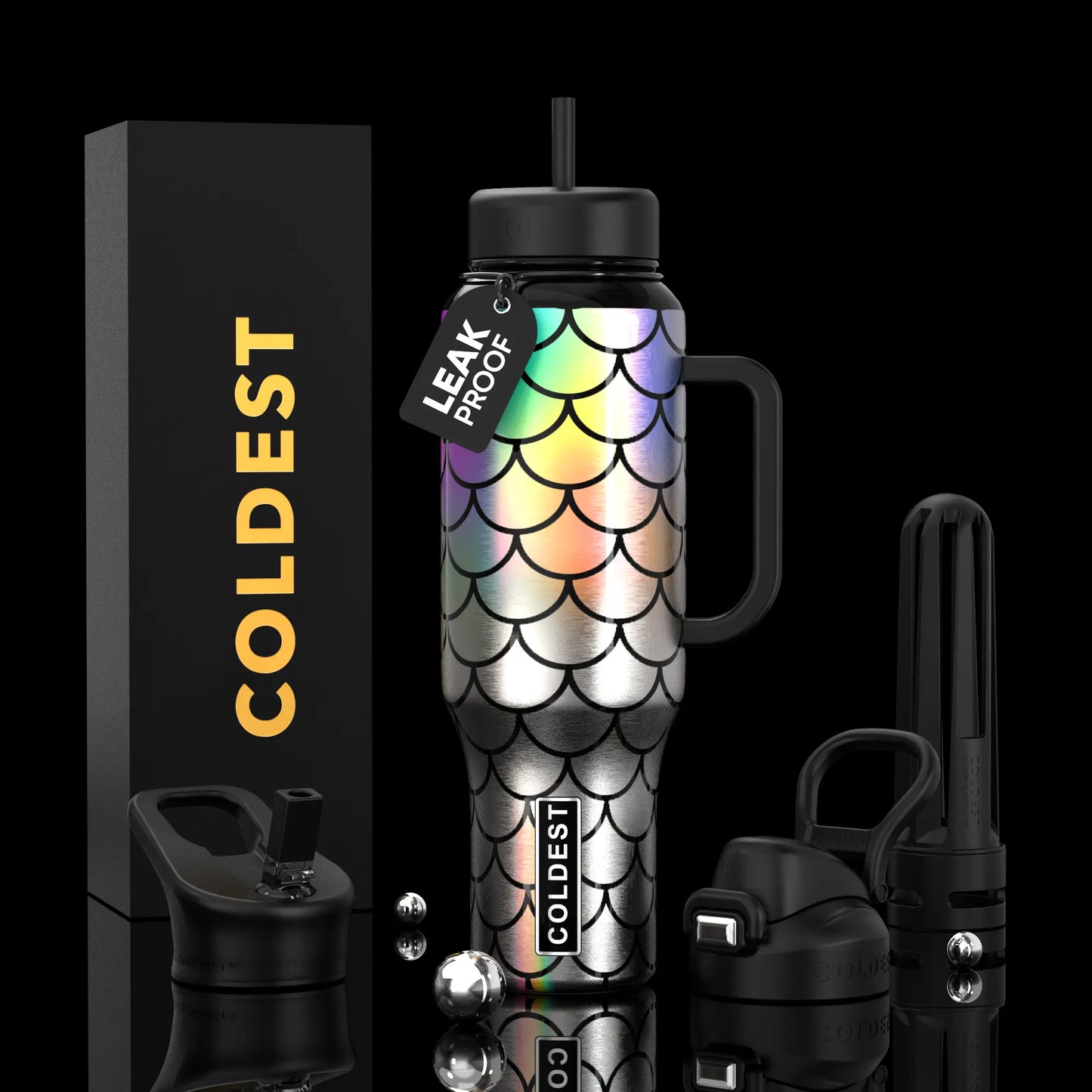 Iridescent mermaid scale water bottle with black lid, handle, and leak-proof tag, beside COLDEST box and accessories