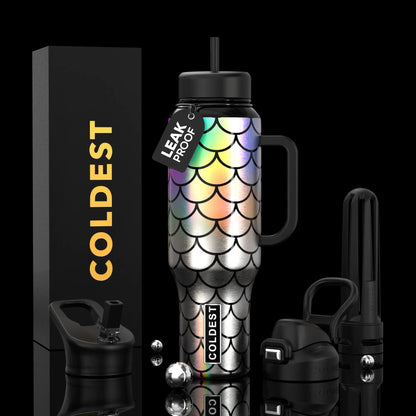 Iridescent mermaid scale water bottle with black lid, handle, and leak-proof tag, beside COLDEST box and accessories