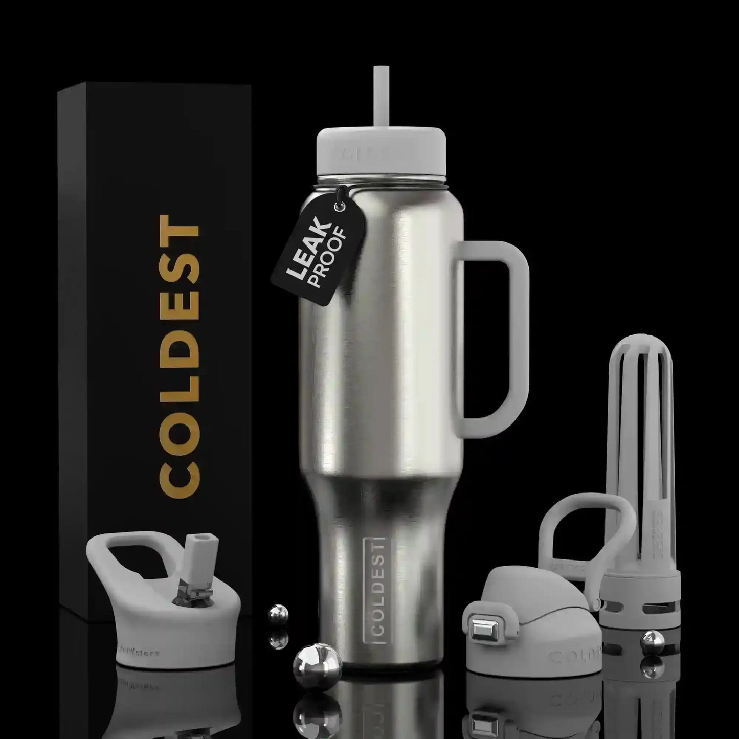 Coldest leak-proof stainless steel tumbler with straw lid, handle, and accessories on black background