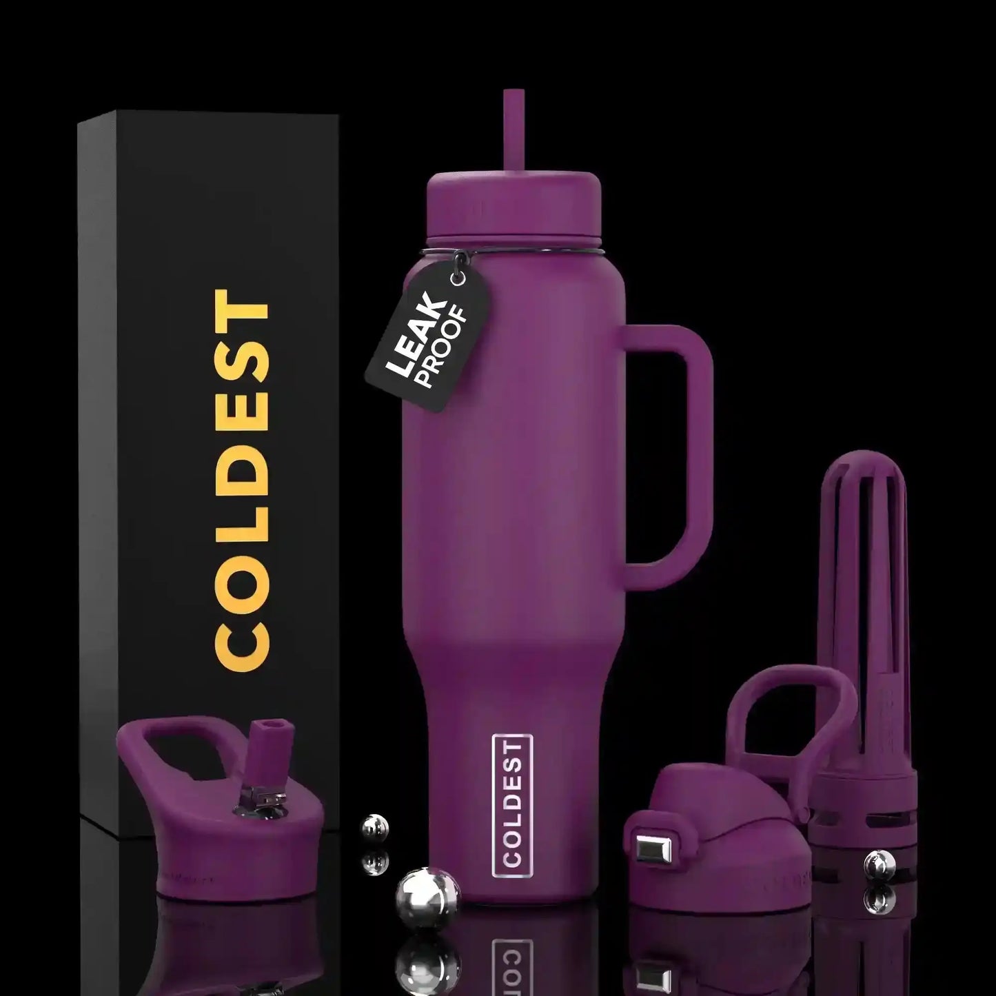 Purple leak-proof COLDEST tumbler with handle, straw, and accessories, shown with branded box on black background.