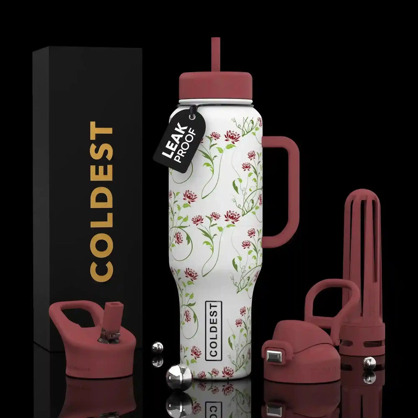 Floral print leak-proof water bottle with handle, pink lid, and COLDEST branding, shown with accessories and packaging