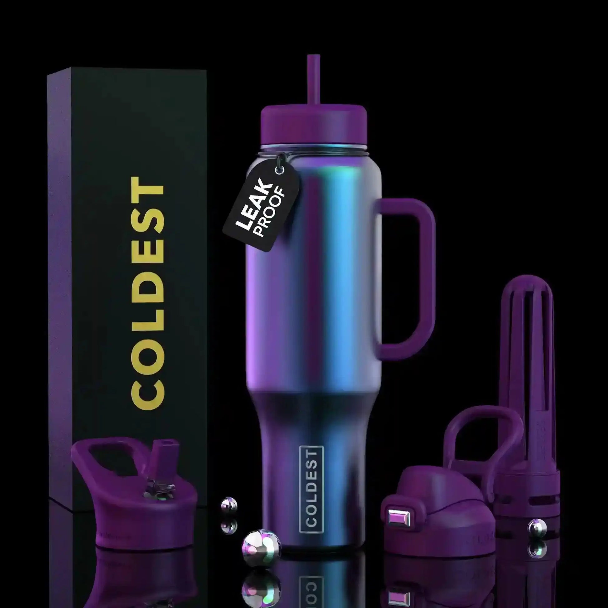 Iridescent purple COLDEST leak-proof travel tumbler with handle, straw, and accessories on black background